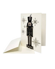 The Strawberry Shop s.e.hagarman ivory Christmas card featuring a black nutcracker embellished with crystals and glitter
