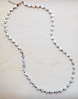 **Long Mother-of-Pearl Cross Necklace 259p