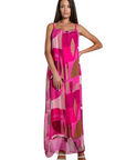 The Strawberry Shop Marla maxi dress in pink silk with a funky retro geometric print, spaghetti straps, and side slits