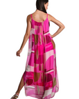 The Strawberry Shop Marla silk maxi dress in a pink retro geometric print with spaghetti straps and side slits.