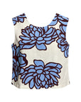 The Strawberry Shop sleeveless top with a blue floral print on a cream background. Features a scoop neckline and a relaxed fit.
