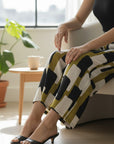 The Strawberry Shop Foil Pants FO6918: Wide-leg cropped pants in a graphic print of black, white, and olive green blocks.