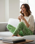 The Strawberry Shop green and white abstract print foil pants with a slim fit.