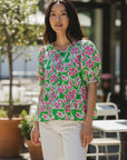 The Strawberry Shop green and pink floral print 100% cotton tiered peasant top with puff sleeves.