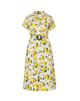 The Strawberry Shop white cotton midi dress with yellow lemon print, V-neck, short sleeves, belted waist, and button front.