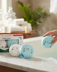 The Strawberry Shop Bubbly Belle set of 2 handmade snowman bath bombs, one white and one blue, with Christmas fragrances.