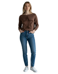 The Strawberry Shop Compli K chocolate brown knit sweater featuring a star fringe detail worn with blue jeans