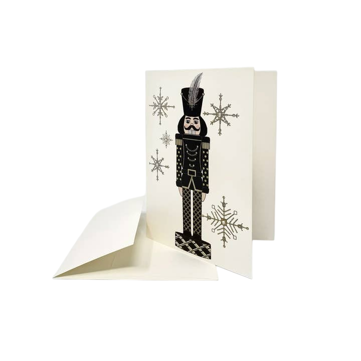 The Strawberry Shop s.e.hagarman ivory Christmas card featuring a black nutcracker embellished with crystals and glitter