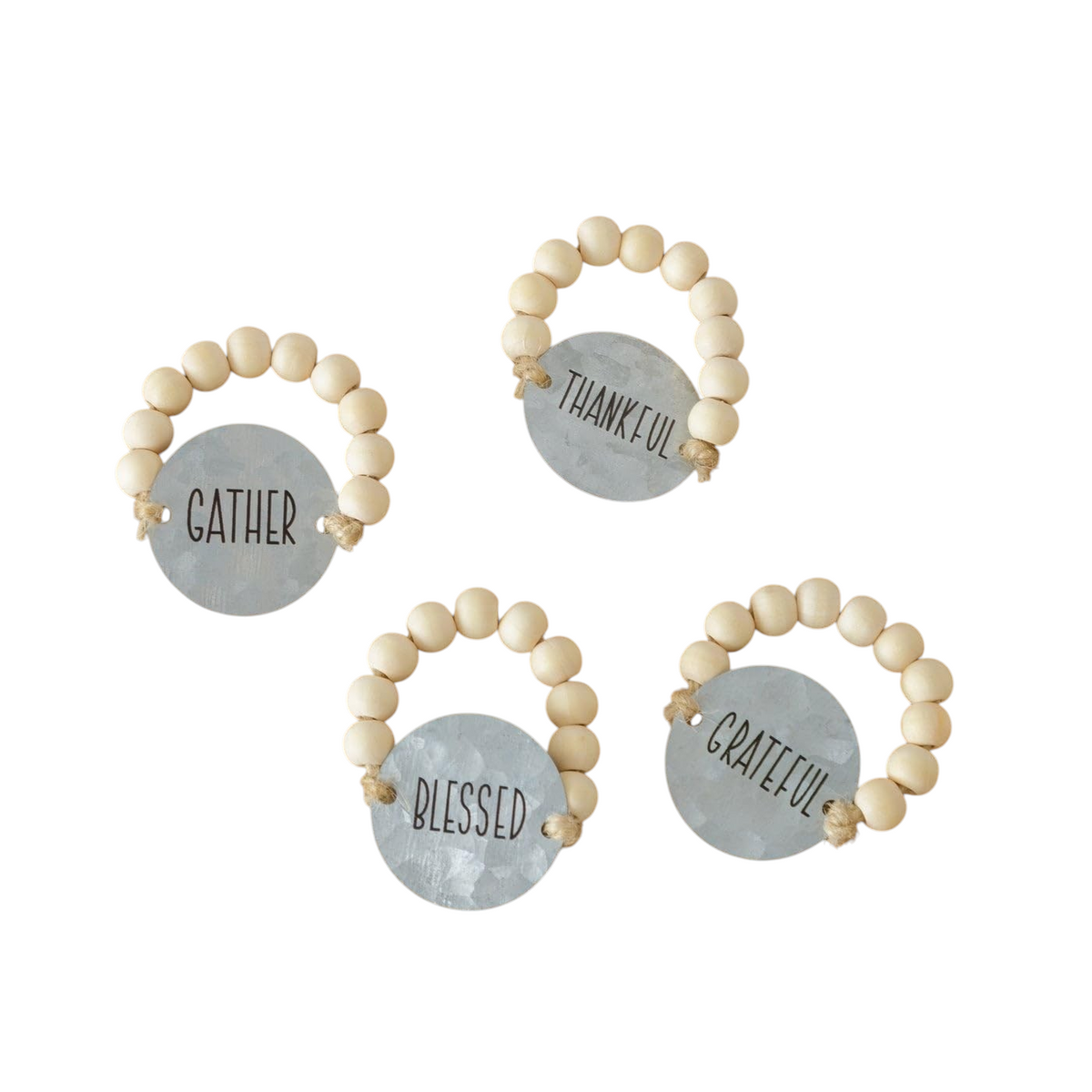 The Strawberry Shop Thanksgiving napkin rings with natural wood beads and distressed metal tags reading thankful words.