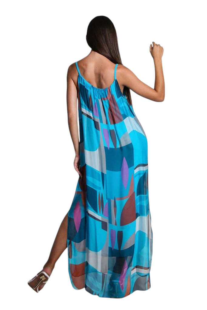 The Strawberry Shop Marla silk maxi dress in a blue retro geometric print with spaghetti straps and side slits