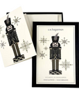 The Strawberry Shop s.e.hagarman nutcracker stationery set with crystal and glitter embellished ivory holiday cards.