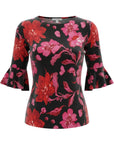 The Strawberry Shop La Mer Luxe Susan top in black with a vibrant floral print of pink and red flowers. Features 3/4 sleeves and a comfortable knit fabric.