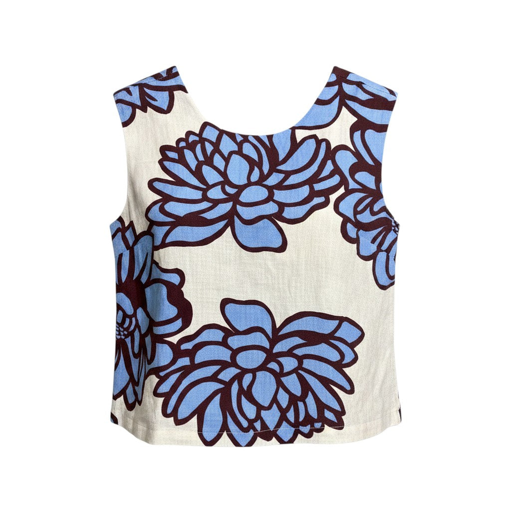 The Strawberry Shop sleeveless top with a blue floral print on a cream background. Features a scoop neckline and a relaxed fit.