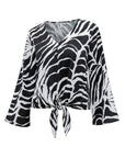 The Strawberry Shop La Mer Luxe black and white zebra print rayon tie-front top with 3/4 sleeves.