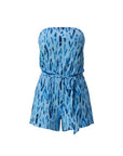 The Strawberry Shop strapless knit Raina romper in navy and blue tie-dye print with a belted waist and side slits. Made of polyester and spandex.