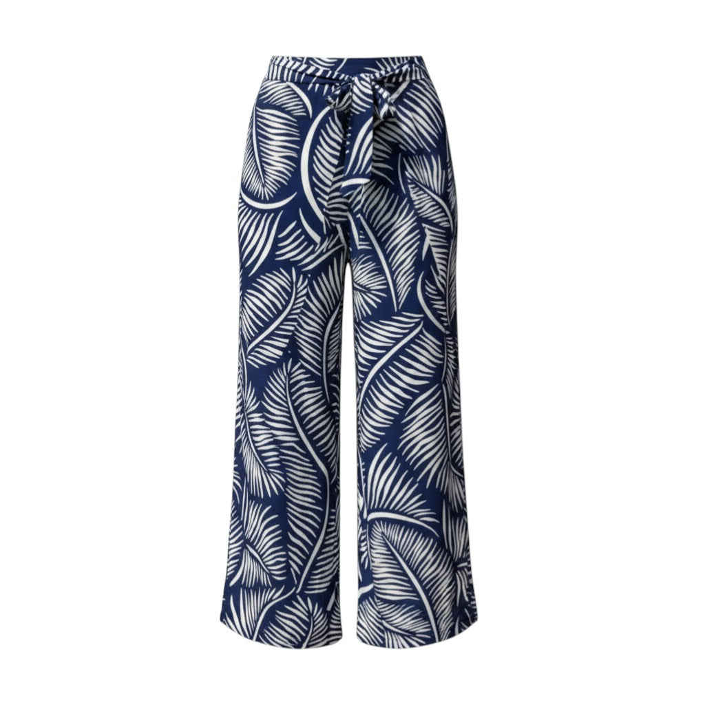 The Strawberry Shop La Mer Luxe navy and white palm print knit wrap front pants, made of polyester and spandex.