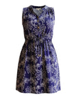 The Strawberry Shop navy rayon Lilly Dress with white palm print, V-neck, drawstring waist, and gold button details.