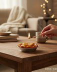 The Strawberry Shop apple tart candle with cinnamon dusting and a pie crust.