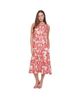 The Strawberry Shop sleeveless CompliK dress with a red floral print on a cream background, featuring a collared neckline and pockets.