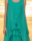 The Strawberry Shop sleeveless emerald green silk blend dress with layered panels and raw-edge hems on a model.