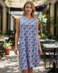 The Strawberry Shop sleeveless cotton slub dress with notch neck and fan print in blue, pink, and purple. Features 2 side pockets.