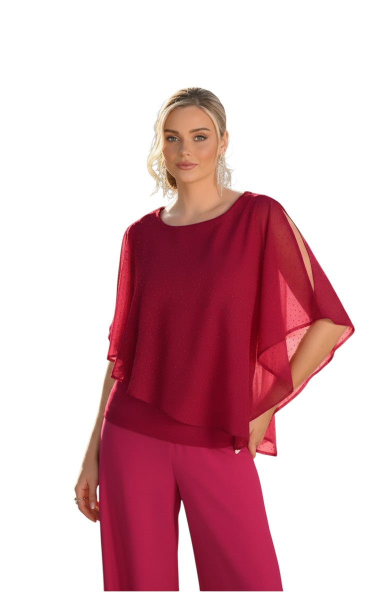 The Strawberry Shop Frank Lyman red chiffon layered top with split sleeves worn by a model in a garden setting
