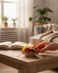 The Strawberry Shop fruit tart candle with realistic berries and kiwi slices in a pie crust.