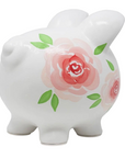 The Strawberry Shop Gypsy Rose Piggy Bank in white ceramic with handpainted pink and red rose floral motifs.