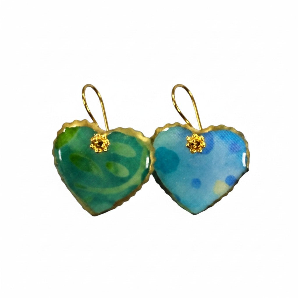 The Strawberry Shop blue and green watercolor heart enamel drop earrings with gold daisy accents.