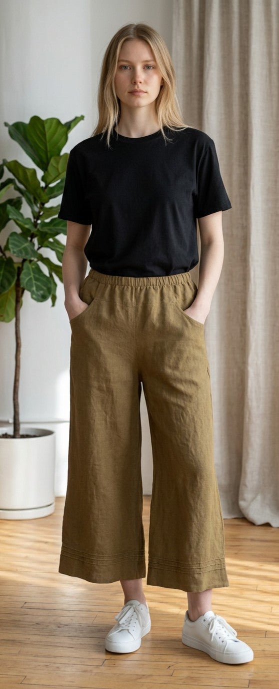 Model wearing The Strawberry Shop Kleen hickory capri pants with an elastic waist and pockets, styled with a black tee
