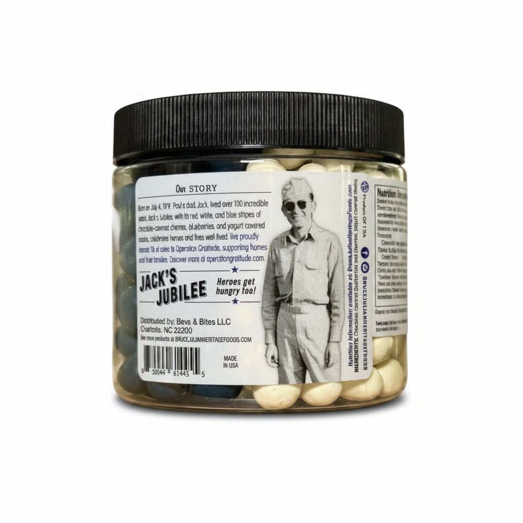 The Strawberry Shop Jack's Jubilee jar with chocolate covered cherries, blueberries, and yogurt covered raisins. Red, white, and blue stripes on label.