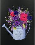 The Strawberry Shop Papyrus Mother's Day card with a watering can filled with purple, pink, and red flowers.