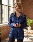 The Strawberry Shop navy blue satin blouse with rhinestone collar and button-up front.