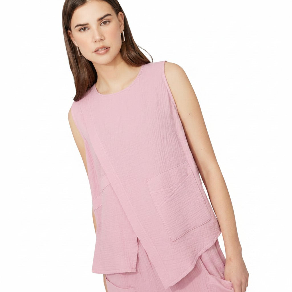 The Strawberry Shop pink gauze sleeveless top with two front pockets and a relaxed fit.
