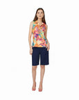 The Strawberry Shop white knee-length Bermuda shorts with side pockets and a relaxed fit. Made from rayon, nylon, and spandex.