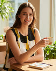 The Strawberry Shop Foil Top FO6917: Sleeveless scoop neck top with abstract black, white, and mustard yellow block print.