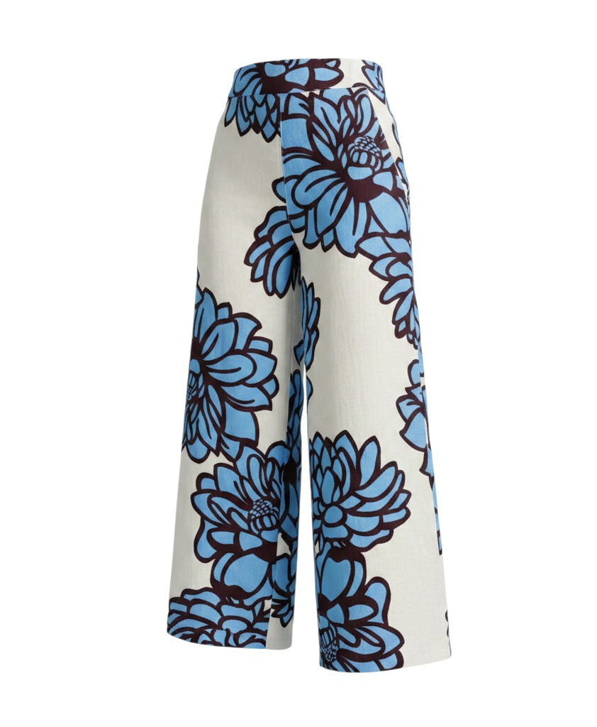 The Strawberry Shop It's Only Natural linen pants in white with a bold blue and dark red floral print. Relaxed fit, wide leg.