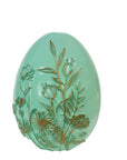 The Strawberry Shop mint green egg decor with embossed gold floral design.