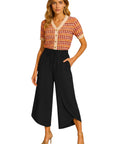 The Strawberry Shop Orly flowy cropped orange polyester pants with drawstring waist and side pockets.