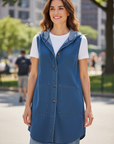 The Strawberry Shop Heartstring by Kleen Denim Hooded Vest in stone blue, 85% Tencel, 15% Cotton. Sleeveless with front button closure.